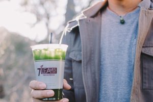 a photo of cold japanese matcha and soy drink in a cup