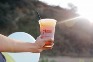 a photo of cold sea cream tea jasmine drink in a cup