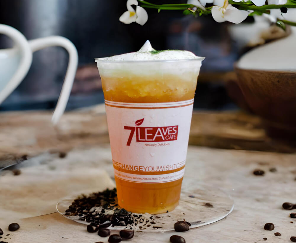 a photo of cold sea cream tea jasmine drink in a cup
