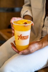 a photo of cold sunset passion drink in a cup
